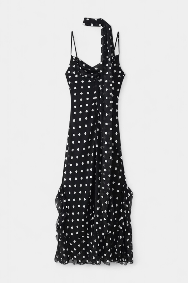 Stylish women's polka dot summer dress with adjustable straps, perfect for a romantic day or evening out.