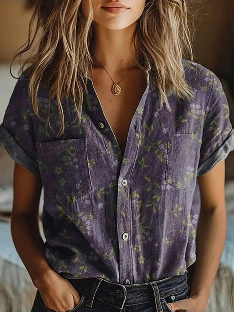 Women's chic purple collared button-up blouse with short rolled sleeves, ideal for smart casual or work attire.