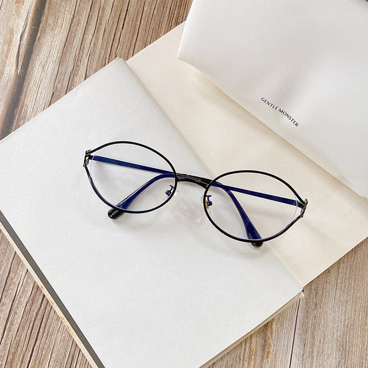 Modern women's round sunglasses. Chic style & eye protection, enhanced by beautiful gold accents.