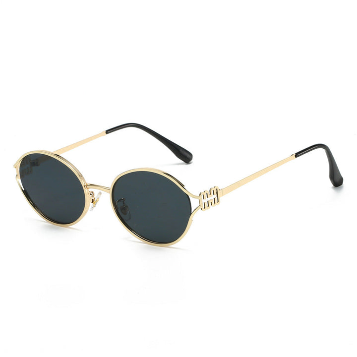Versatile women's round sunglasses. Chic gold accents elevate this essential fashion accessory.