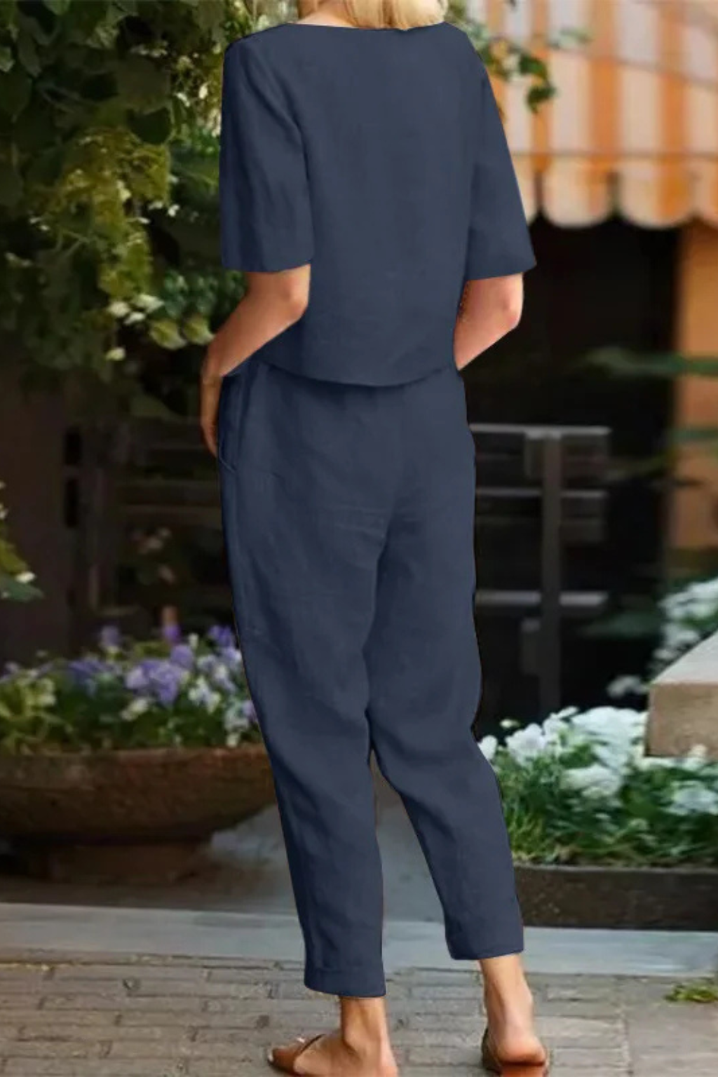 Summer fashion: Women's short sleeve crop top and tapered trousers matching set. Ideal for warm weather, casual style.