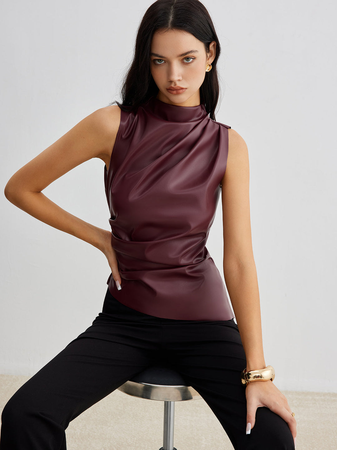 Women's chic sleeveless high neck summer top. Elegant & modern tank for versatile daytime or evening wear.