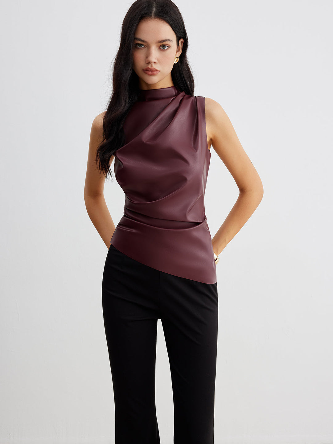 Stylish women's sleeveless high neck top perfect for summer fashion. Chic & modern design for elegant wear.