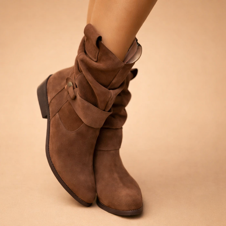 Fashionable women's slouch ankle boots featuring a sleek modern buckle, great for winter comfort.