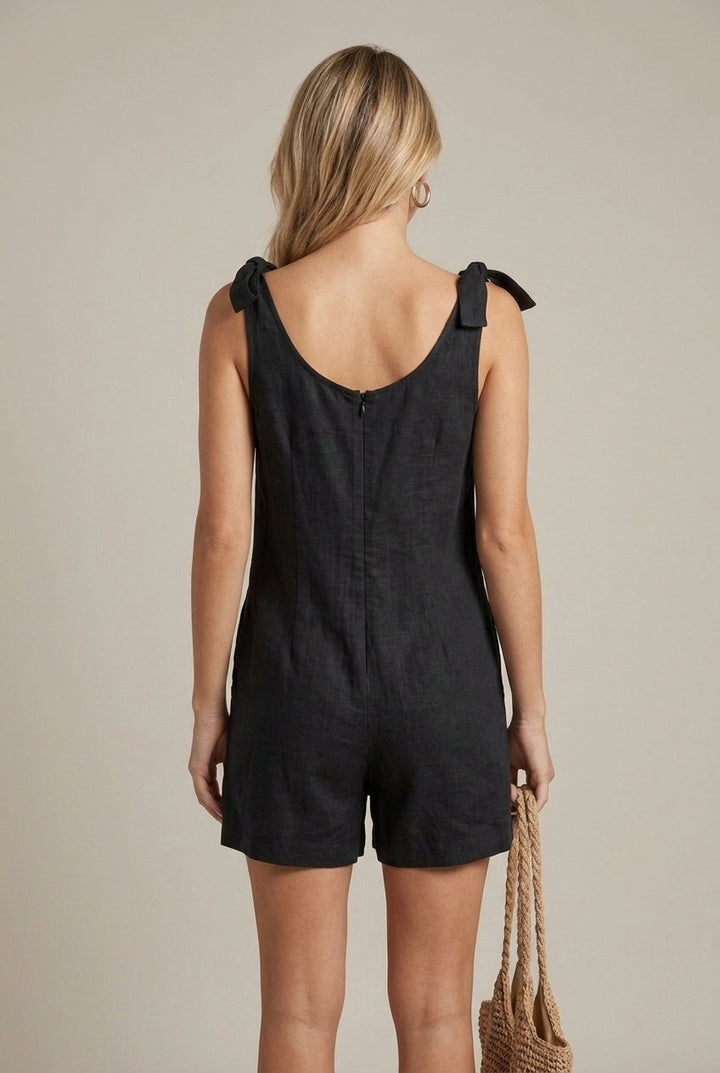 Chic women's one-piece playsuit with a square neck & cute bow straps. Great for casual summer fashion.