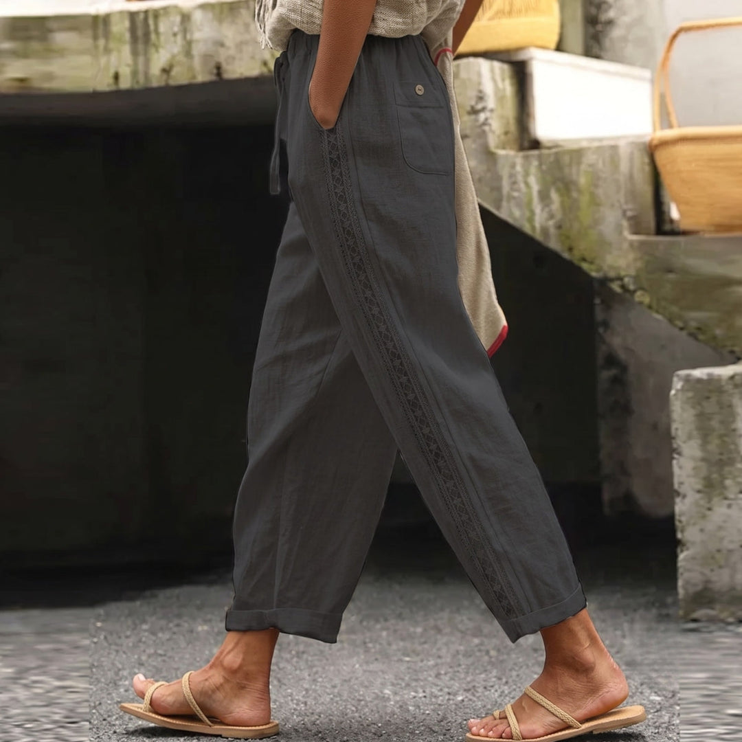 Stylish women's striped high waist pants. Chic and versatile for summer fashion, offering an effortless look.