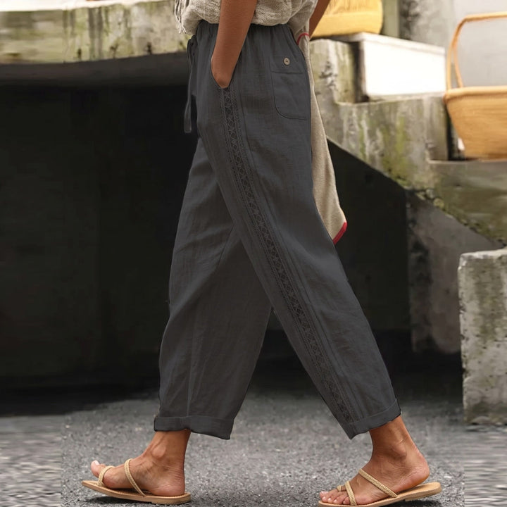 Stylish women's striped high waist pants. Chic and versatile for summer fashion, offering an effortless look.