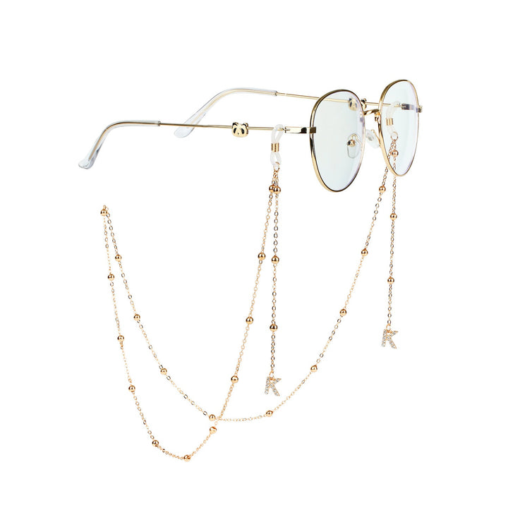 Women's chic sunglasses chain, a stylish eyewear holder accessory for secure glasses.