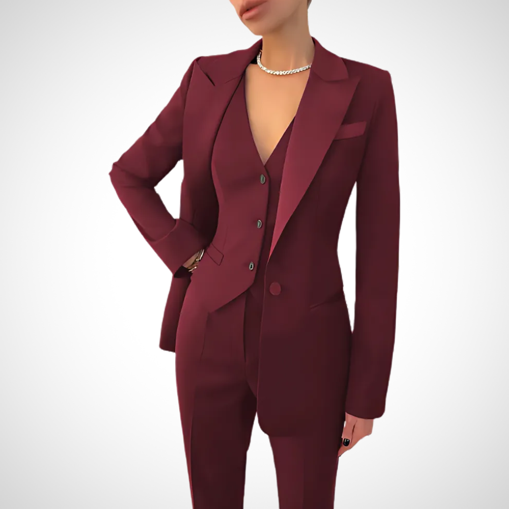 Elegant women's tailored three-piece suit. Chic blazer, vest & trousers for a sophisticated business or formal look.