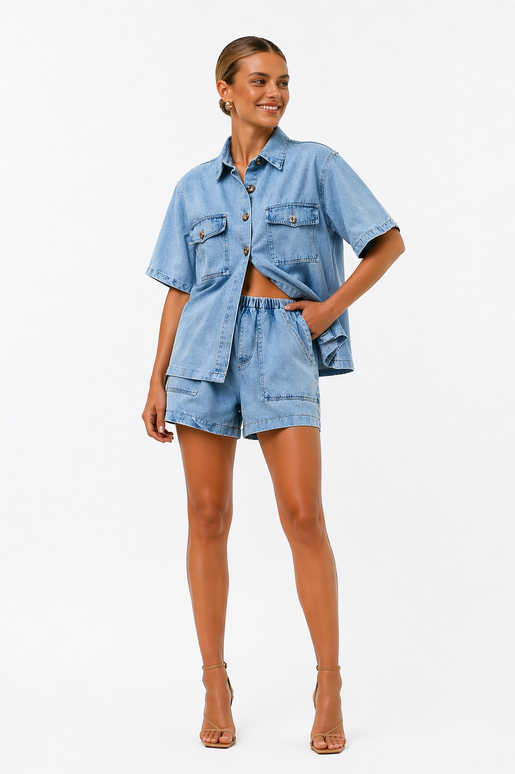 Fashionable women's high-waist shorts set with a matching shirt, ideal for a chic summer look.