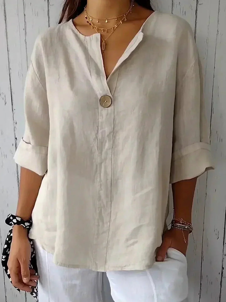 Women's chic V-neck button-down blouse with roll sleeves, perfect for casual spring/summer wear.