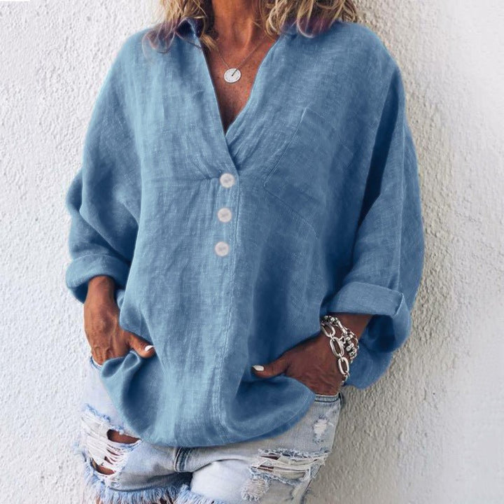 Comfortable pink V-neck long sleeve blouse for women. Oversized fit button-front top for effortless casual chic.