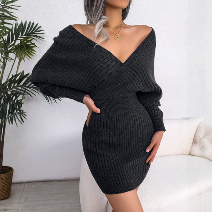 Fitted women's bodycon mini dress with wrapped V-neck and long sleeves. Stylish & figure-flattering.