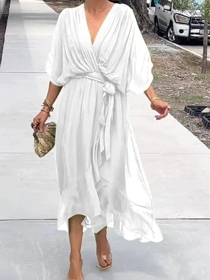 Elegant women's V-neck belted midi cocktail dress in flowy chiffon, ideal for summer parties.