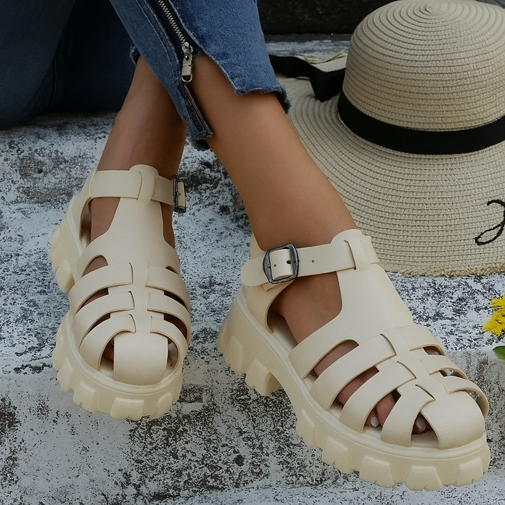Women's chunky caged platform sandals with a stylish buckle strap. Perfect for summer casual fashion and street style.