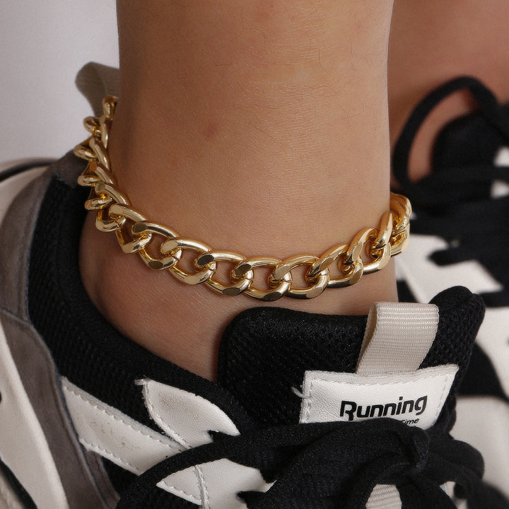 Women's chunky gold link chain bracelet, a stylish fashion accessory. Perfect statement jewelry.