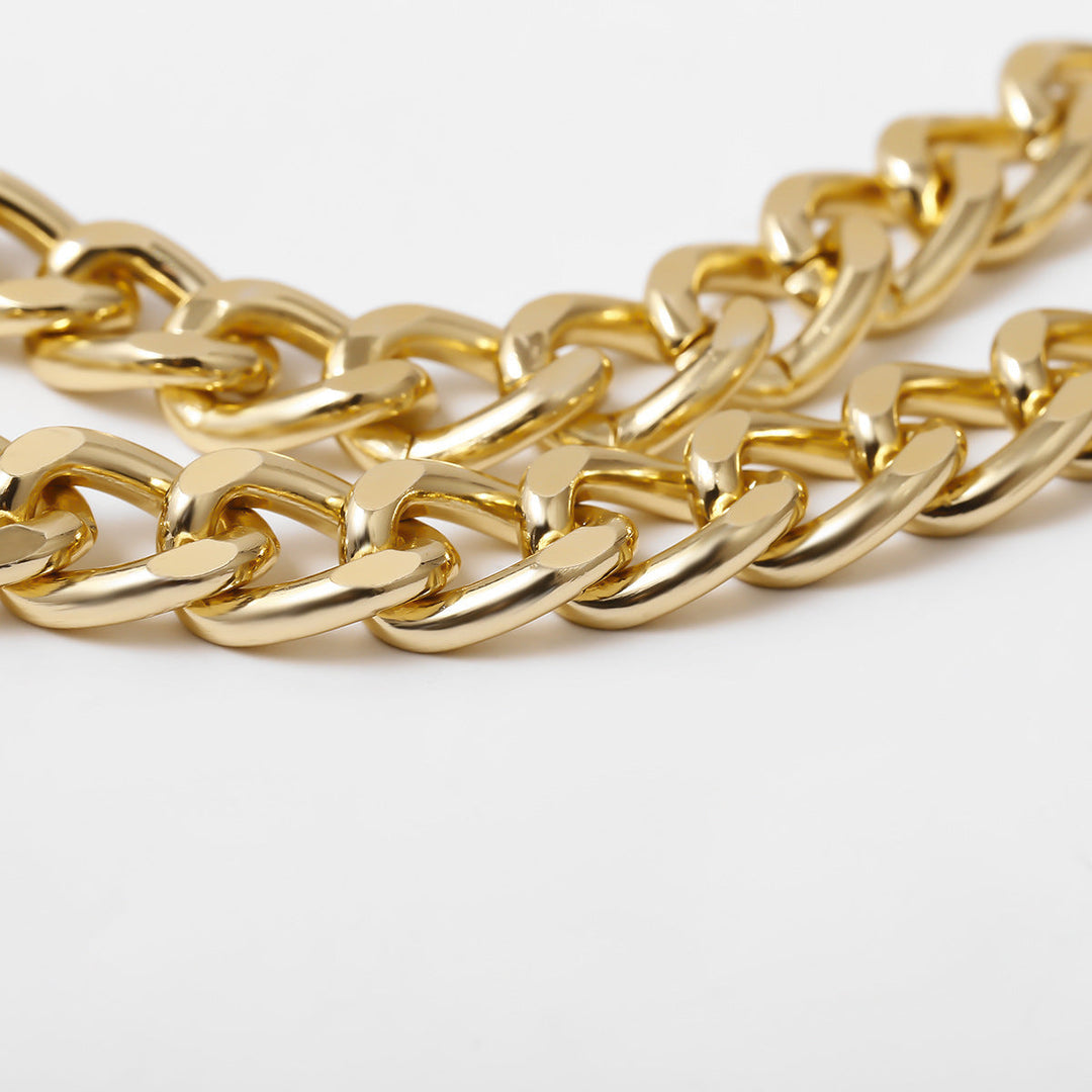 Gold chunky link chain bracelet for women, a bold statement fashion accessory. Stylish metal jewelry.