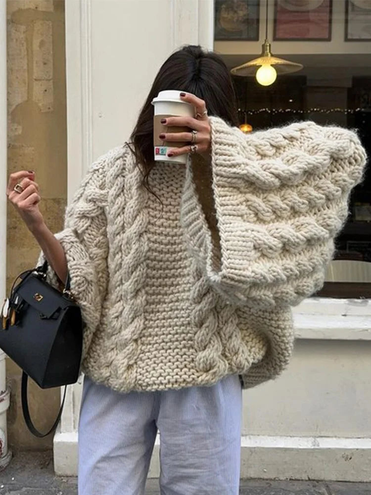 Trendy women's relaxed fit chunky knit sweater. Oversized, long-sleeve, ideal for casual fall/winter wear.