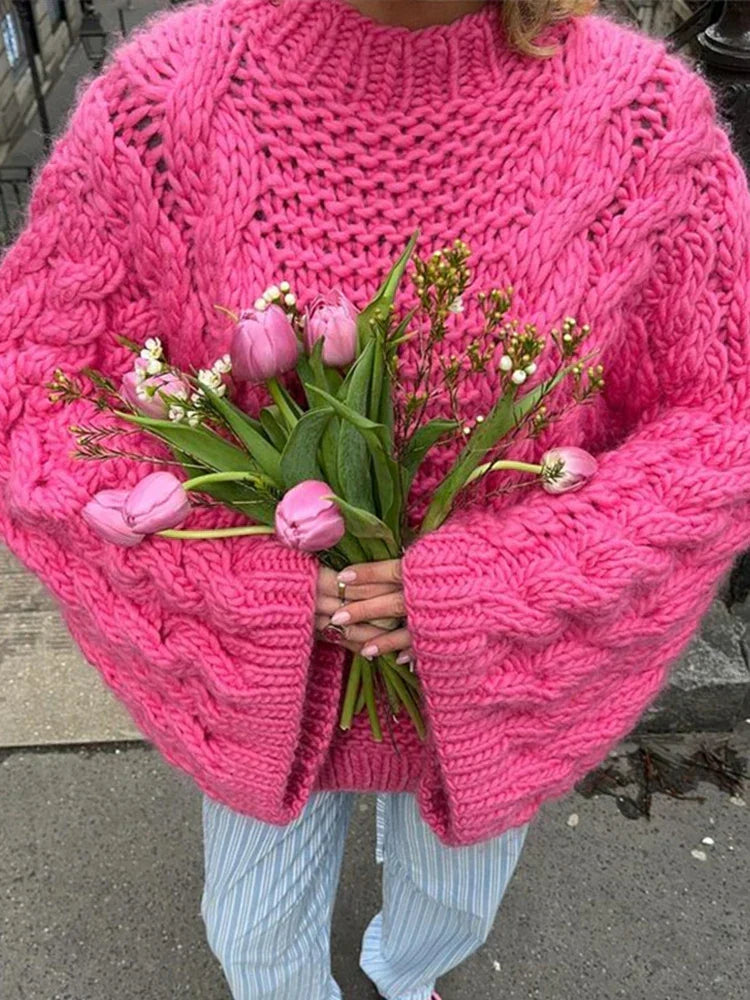 Soft women's chunky knit sweater with a relaxed, oversized fit. Long sleeves, cozy for winter fashion.