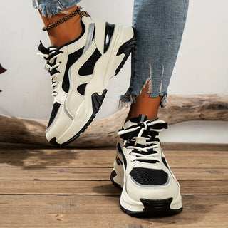 Stylish women's platform chunky sneakers with panelled design. Comfortable lace-up shoes for trendy casual looks.