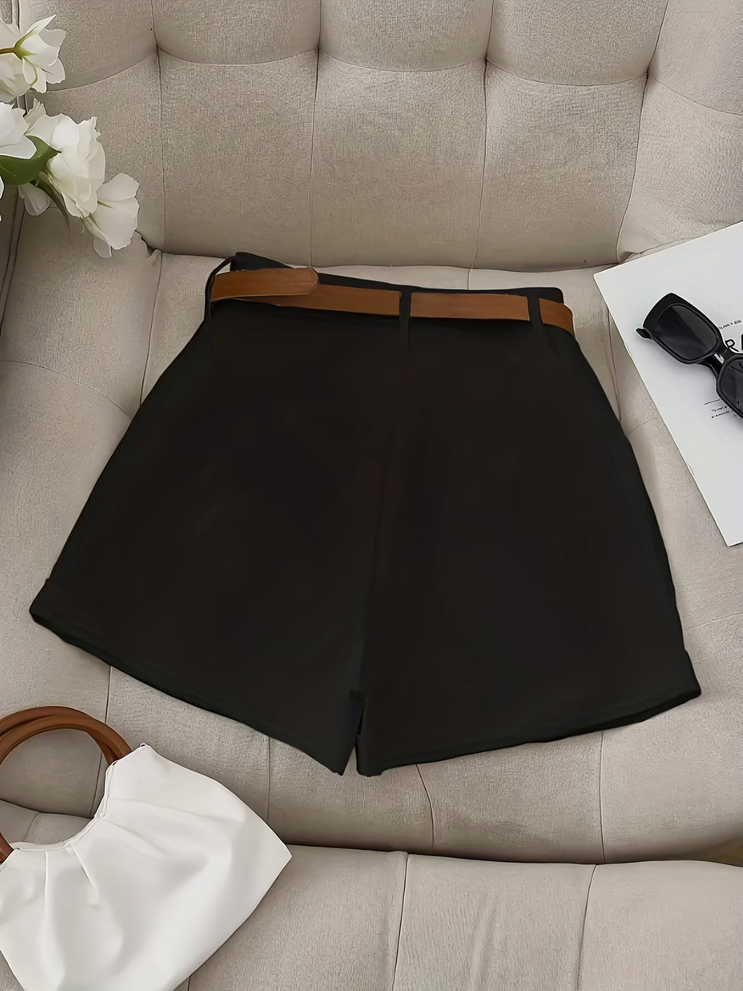 Chic white belted shorts for women. Perfect for a comfortable, versatile summer look. Effortless casual ladies' fashion.