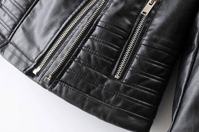 Stylish women's asymmetrical biker jacket in black, a classic piece for year-round edgy fashion.
