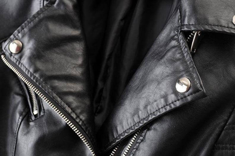 Edgy black classic biker jacket for women, stylish asymmetrical front, perfect for a bold fashion statement.