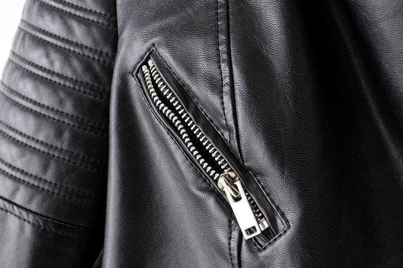 Women's classic style biker jacket, black, with unique asymmetrical details and durable construction.