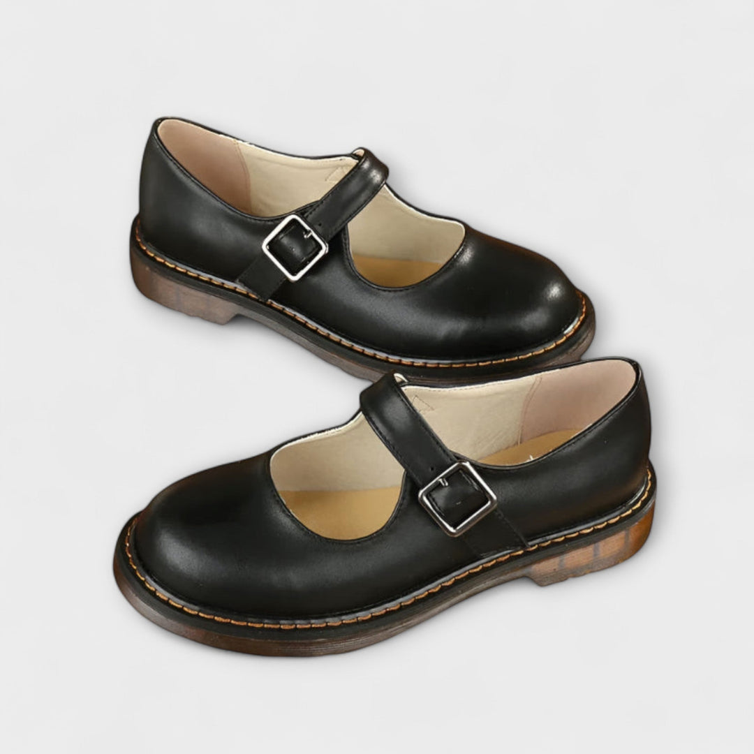 Women's classic black Mary Jane shoes with buckle strap, ideal for work, everyday wear, and elegant ladies fashion.