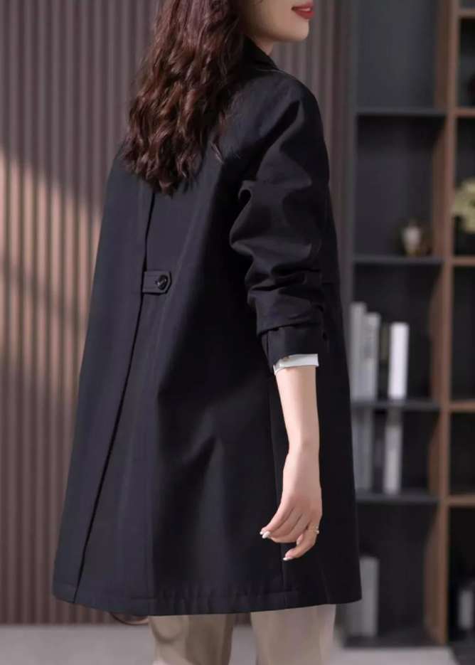 Elegant women's short trench coat in black, featuring a single button closure for a modern classic look.