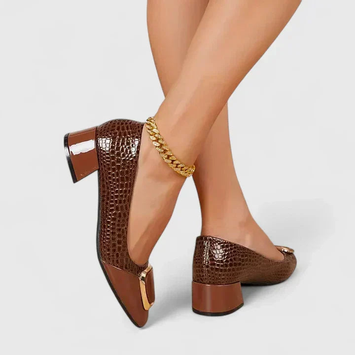 Women's classic block heel loafers with elegant decorative detail, perfect for office wear.
