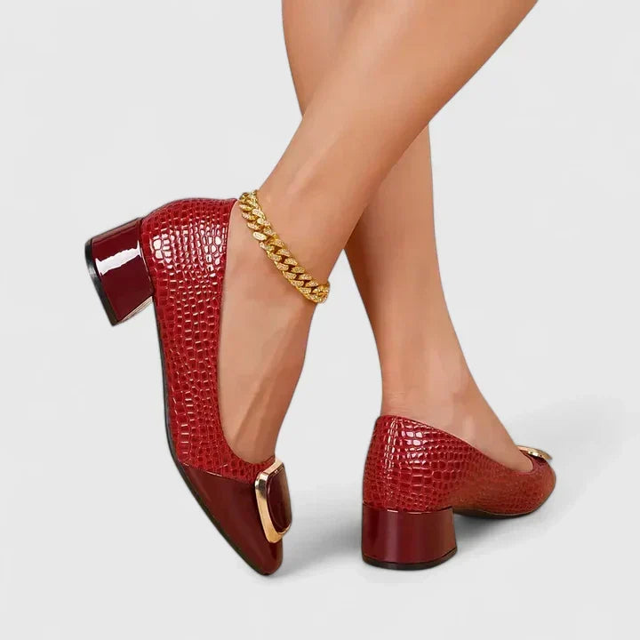 Chic women's slip-on loafers with comfortable block heel and decorative accent, ideal for daily fashion.