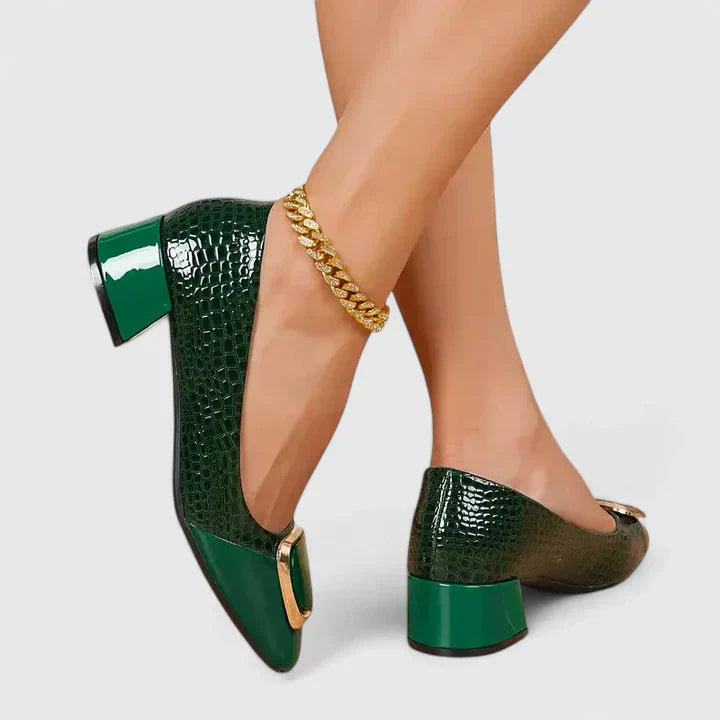 Elegant women's block heel loafers featuring sophisticated decorative detail. Great for office or casual.