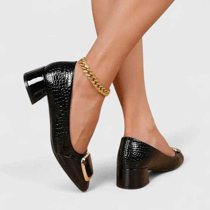 Classic women's loafers, block heel style with unique decorative detail. Comfortable office footwear.