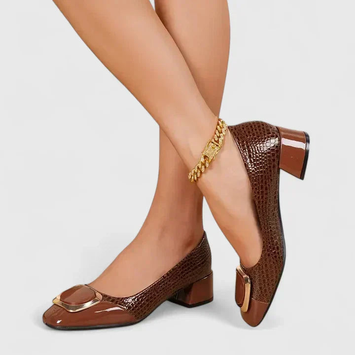 Stylish women's black block heel loafers. A classic slip-on design with a chic decorative accent.