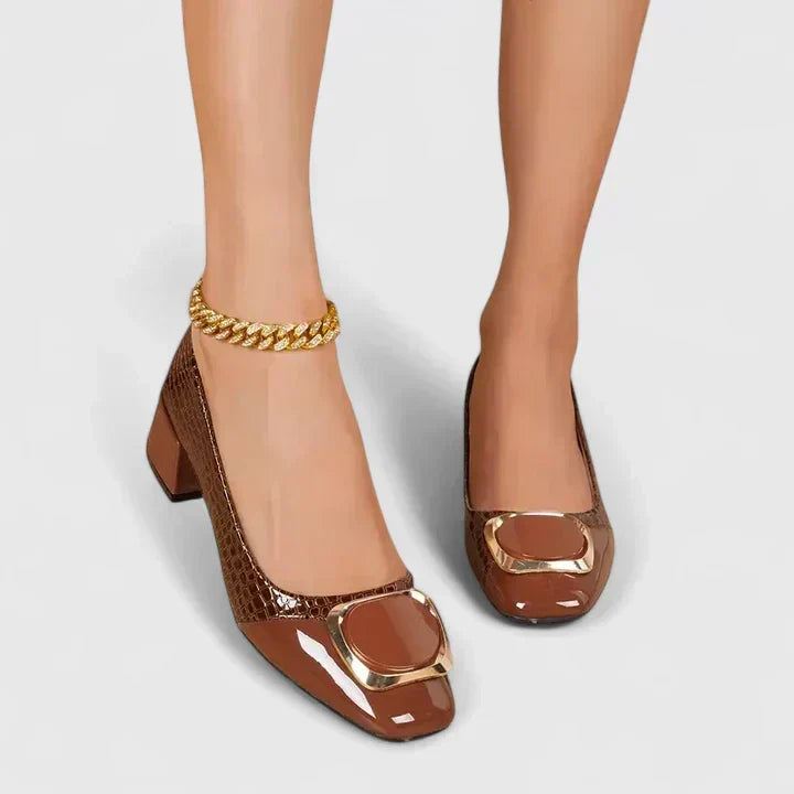 Comfortable women's block heel loafers, classic slip-on design with elegant decorative detail. Fashionable footwear.