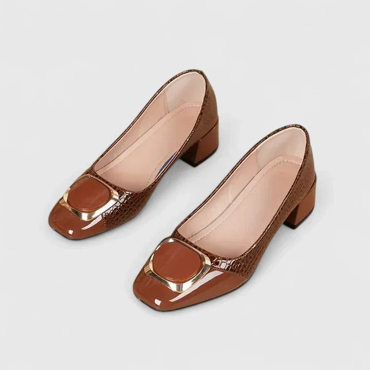 Women's classic block heel loafers. Slip-on elegant shoes with chic decorative detailing for office wear.