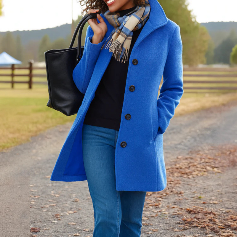 Women's sophisticated long button-up jacket. Elegant, classic, and versatile outerwear for autumn/winter.