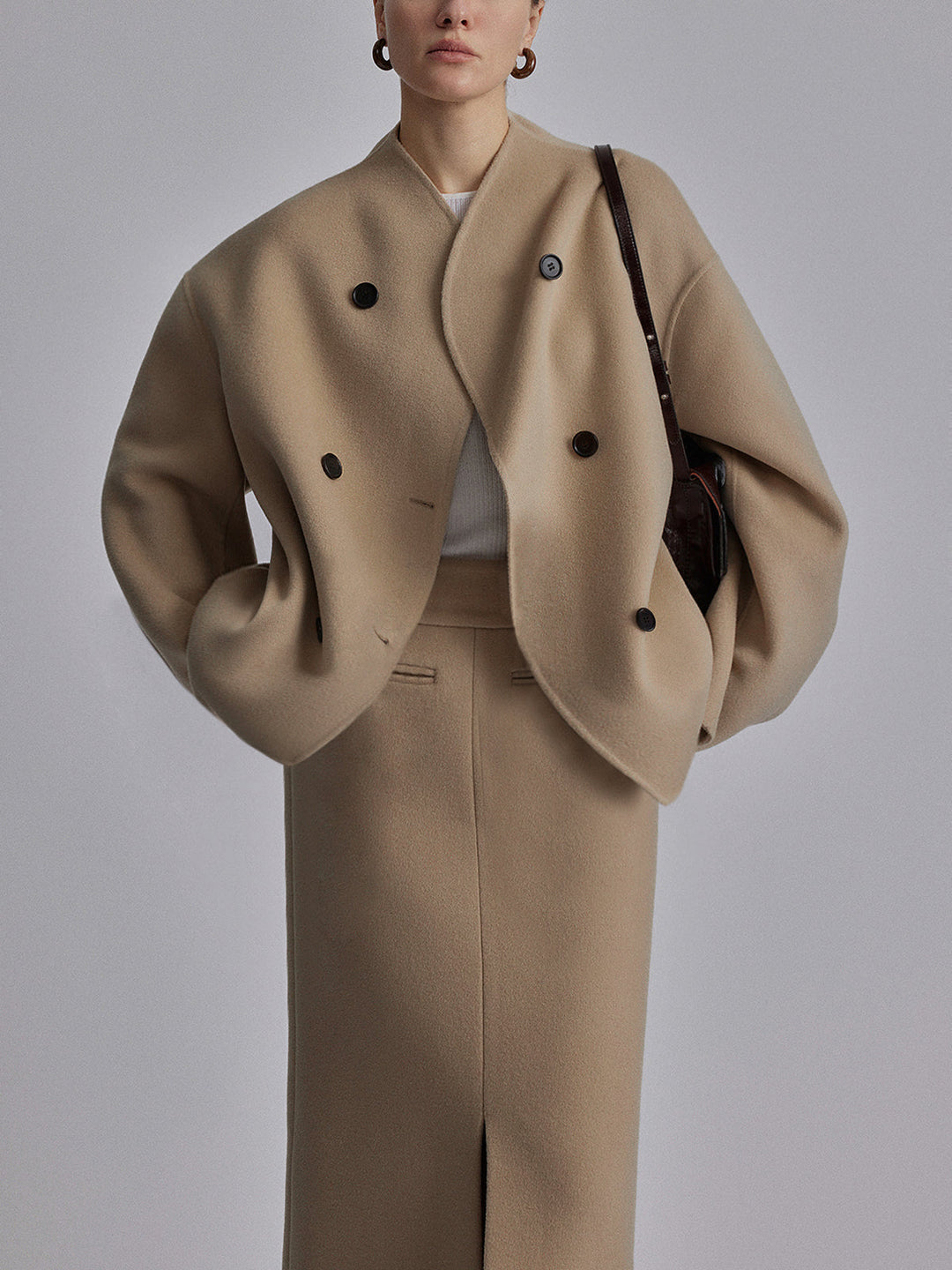 Double-breasted women's pea coat. A stylish, versatile jacket providing classic warmth for winter.