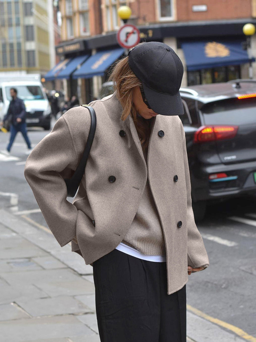 Stylish women's double-breasted pea coat, ideal for fall & winter fashion. Stay warm & chic.