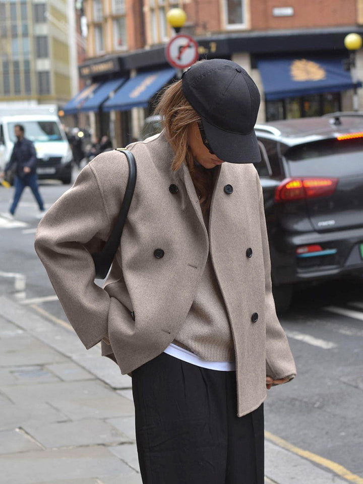 Stylish women's double-breasted pea coat, ideal for fall & winter fashion. Stay warm & chic.