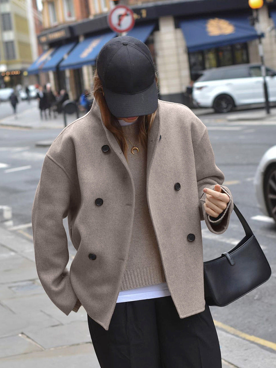 Elegant women's pea coat. Classic double-breasted design ensures warmth & timeless style.