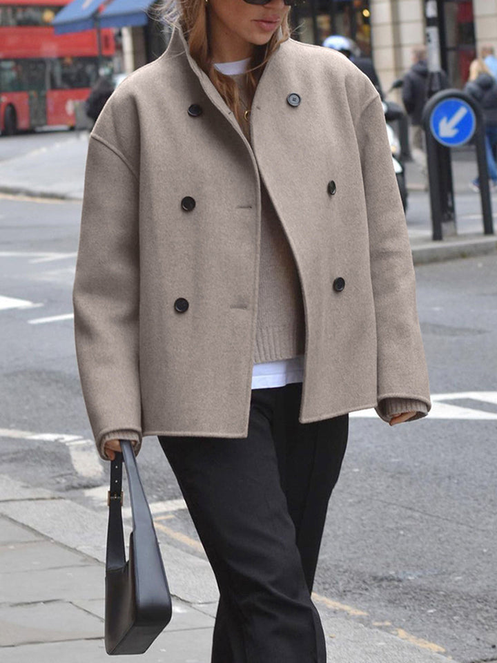 Versatile women's winter pea coat. Double-breasted jacket for stylish and warm outerwear.