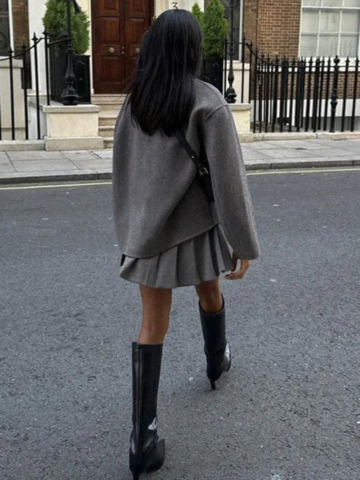 Classic women's pea coat with double-breasted closure. A warm & elegant jacket for cold weather.