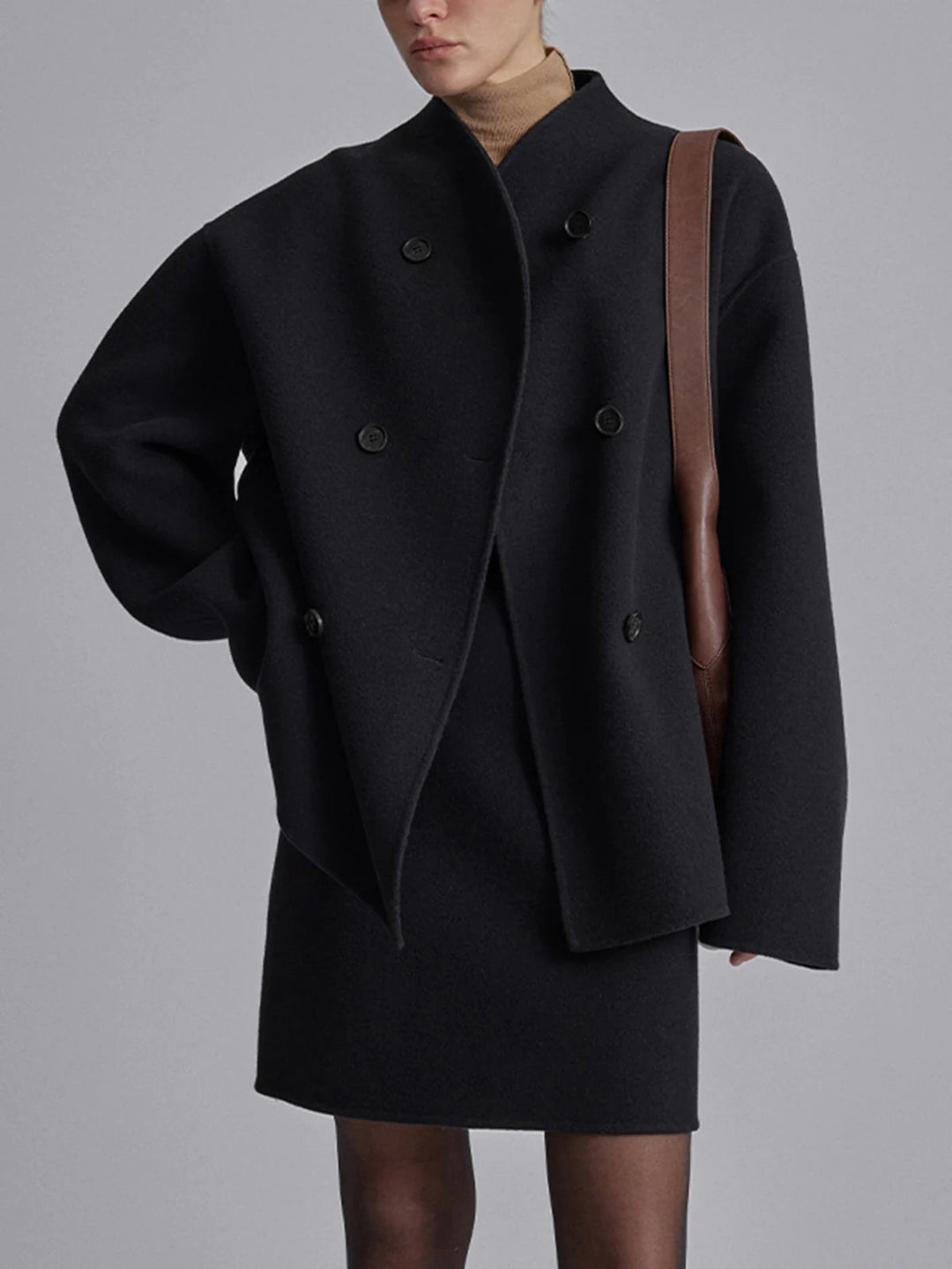 Women's warm pea coat jacket. Double-breasted classic style for elegant and comfortable winter outerwear.