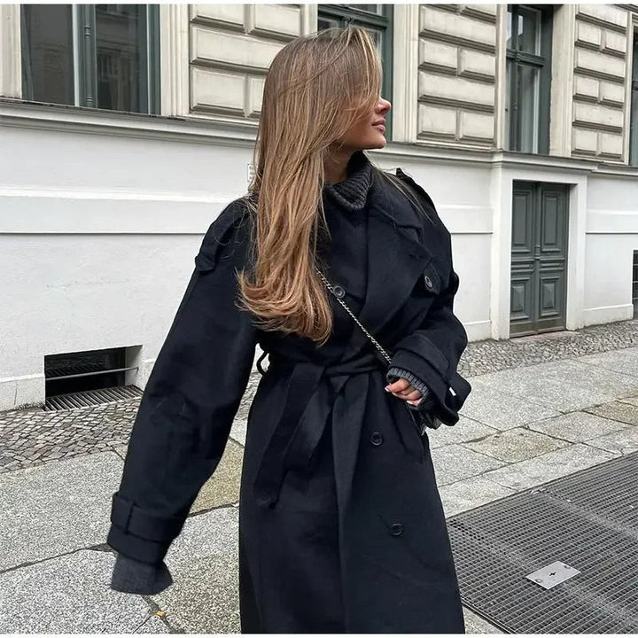 Sophisticated women's belted trench coat, classic double-breasted style, ideal for winter outerwear fashion.