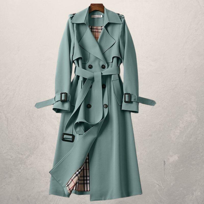 Front view of women's long double-breasted trench coat with a belt, suitable for cooler weather.