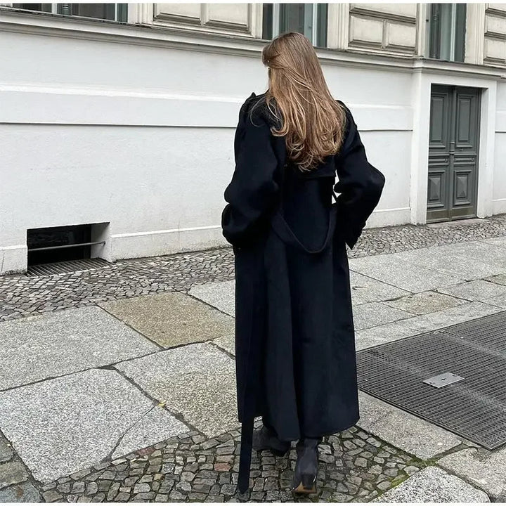 Stylish women's double-breasted trench coat, a classic long jacket with belt, essential fall & winter outerwear.