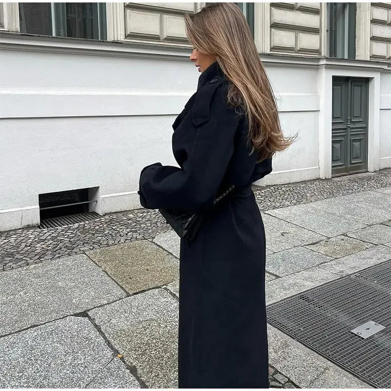 Model wearing a women's classic double-breasted trench coat with a cinched belt, elegant and fashionable.