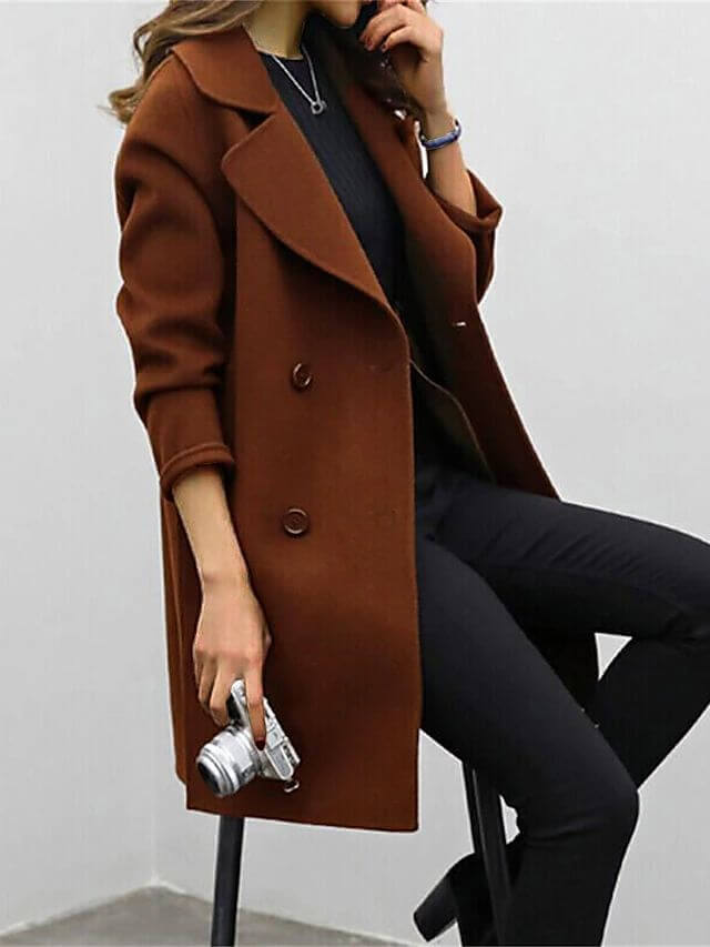 Elegant women's double-breasted winter coat. Classic long-sleeve outerwear for a chic, warm winter look.